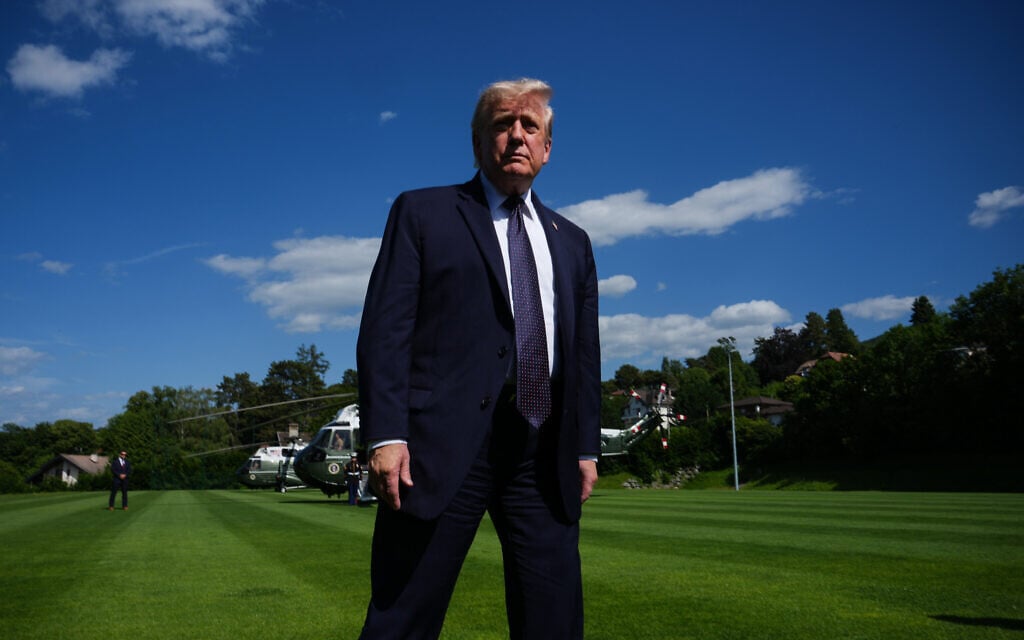 US President Donald Trump walks towards reporters as he arrives for the G7 summit, June 15, 2026, in Evian-les-Bains, France. (AP/Julia Demaree Nikhinson)