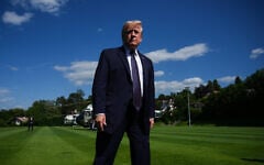 US President Donald Trump walks towards reporters as he arrives for the G7 summit, June 15, 2026, in Evian-les-Bains, France. (AP/Julia Demaree Nikhinson)