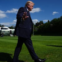 President Donald Trump waves to reporters as he arrives for the G7 summit, June 15, 2026, in Evian-les-Bains, France. (AP Photo/Julia Demaree Nikhinson)