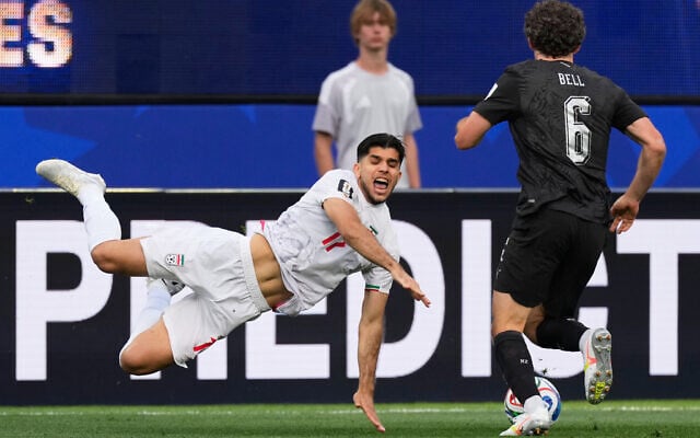 Iran's Arya Yousefi (17) and New Zealand's Joe Bell (6) battle for the ball during the World Cup Group G soccer match between Iran and New Zealand in Inglewood, California, near Los Angeles, June 15, 2026. (AP/Mark J. Terrill)
