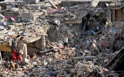 A man who returned to his village following the announcement of an initial ceasefire agreement between the United States and Iran, flashes a victory sign as he stands on the rubble of his destroyed house in Nabatiyeh town, southern Lebanon, June 16, 2026. (Hussein Malla/AP) A man who returned to his village following the announcement of an initial ceasefire agreement between the United States and Iran, flashes a victory sign as he stands on the rubble of his destroyed house in Nabatiyeh town, southern Lebanon, June 16, 2026. (Hussein Malla/AP)