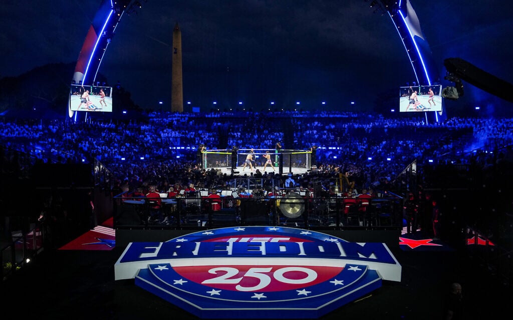 Featherweight fighters Diego Lopez and Steve Garcia compete in the ring during the first fight at UFC Freedom 250 on the South Lawn of the White House, June 14, 2026, in Washington. (AP Photo/Julia Demaree Nikhinson)