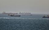 Tankers and cargo vessels are seen in the Gulf of Oman, along shipping routes linking the Strait of Hormuz and the Arabian Sea, June 16, 2026. (AP Photo)
