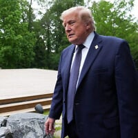 US President Donald Trump walks away after a group photo of leaders at the G7 summit, in Evian-les-Bains, France, June 16, 2026. (Julia Demaree Nikhinson/AP)