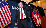 US Senate candidate Mike Collins celebrates during an election-night watch party after winning the Republican nomination, June 16, 2026, in Jackson, Georgia. (AP Photo/Colin Hubbard)
