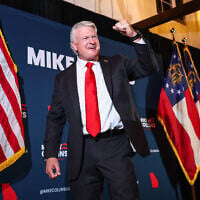 US Senate candidate Mike Collins celebrates during an election-night watch party after winning the Republican nomination, June 16, 2026, in Jackson, Georgia. (AP Photo/Colin Hubbard)