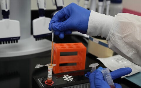 Illustrative: A laboratory technician at bioMérieux's Salt Lake City, Utah, manufacturing facility on June 11, 2026, prepares a sample of a diagnostic test that detects the Ebola Bundibugyo strain responsible for recent outbreaks in Central and East Africa. (Niki Chan Wylie/AP Content Services for bioMérieux)