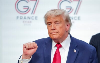 US President Donald Trump gestures as he leaves the stage after a media conference at the end of the G7 summit in Evian-les-Bains, France, June 17, 2026. (AP/Vadim Ghirda)