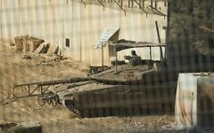 Israeli soldiers cross with a tank from southern Lebanon into northern Israel, June 18, 2026. (AP Photo/Ariel Schalit)