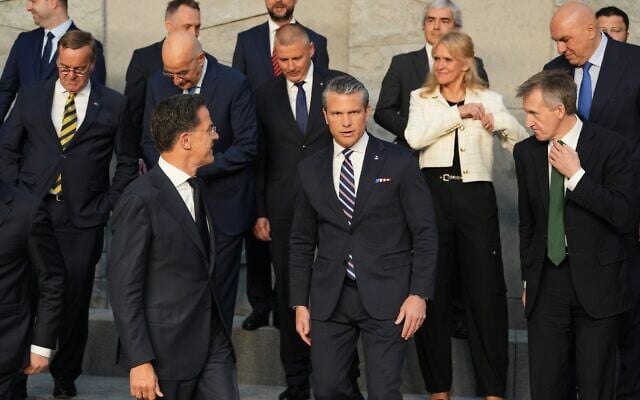From left, Germany's Defense Minister Boris Pistorius, Greece's Defense Minister Nikolaos Dendias, NATO Secretary General Mark Rutte, Hungary's Defense Minister Romulusz Ruszin-Szendi, United States Defense Secretary Pete Hegseth, Iceland's Defense Minister Katrin Gunnarsdottir, British Defense Secretary Dan Jarvis and Italy's Defense Minister Guido Crosetto during a group photo of NATO defense ministers at NATO headquarters in Brussels, Belgium, June 18, 2026. (AP Photo/Virginia Mayo)