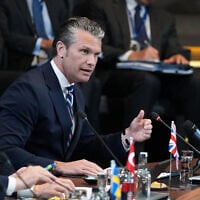 US Defense Secretary Pete Hegseth, right, speaks during a meeting of the North Atlantic Council in defense ministers format at NATO headquarters in Brussels, on June 18, 2026. (AP Photo/Virginia Mayo)