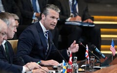 US Defense Secretary Pete Hegseth, right, speaks during a meeting of the North Atlantic Council in defense ministers format at NATO headquarters in Brussels, on June 18, 2026. (AP Photo/Virginia Mayo)