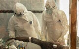 Health workers attend to an Ebola patient at the Rwampara treatment Center in Ituri, Congo, June 18, 2026. (AP Photo/Moses Sawasawa)