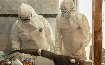 Health workers attend to an Ebola patient at the Rwampara treatment Center in Ituri, Congo, June 18, 2026. (AP Photo/Moses Sawasawa) Health workers attend to an Ebola patient at the Rwampara treatment Center in Ituri, Congo, June 18, 2026. (AP Photo/Moses Sawasawa)