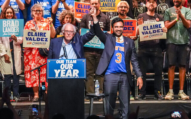 New York City Mayor Zohran Mamdani, right, gestures on stage with Sen. Bernie Sanders during a Get Out The Vote rally ahead of New York's primary election, June 18, 2026, in the Brooklyn borough of New York. (AP/Ryan Murphy) New York City Mayor Zohran Mamdani, right, gestures on stage with Sen. Bernie Sanders during a Get Out The Vote rally ahead of New York's primary election, June 18, 2026, in the Brooklyn borough of New York. (AP/Ryan Murphy)