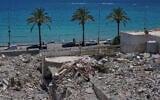A general view shows rubble from buildings destroyed in Israeli strikes along the waterfront in the southern port city of Tyre, Lebanon, June 19, 2026. (AP Photo/Hassan Ammar)