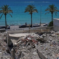 A general view shows rubble from buildings destroyed in Israeli strikes along the waterfront in the southern port city of Tyre, Lebanon, June 19, 2026. (AP Photo/Hassan Ammar)