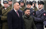 Polish President Karol Nawrocki, left, and Ukrainian President Volodymyr Zelenskyy attend an official welcome ceremony before their meeting at the Presidential Palace in Warsaw, Poland, Dec. 19, 2025. (AP Photo/Czarek Sokolowski, File)