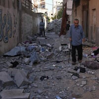 Residents inspect the rubble of the apartment of the Palestinian Safadi family in Gaza City, June 20, 2026, following an overnight Israeli airstrike. (AP Photo/Abdel Kareem Hana)