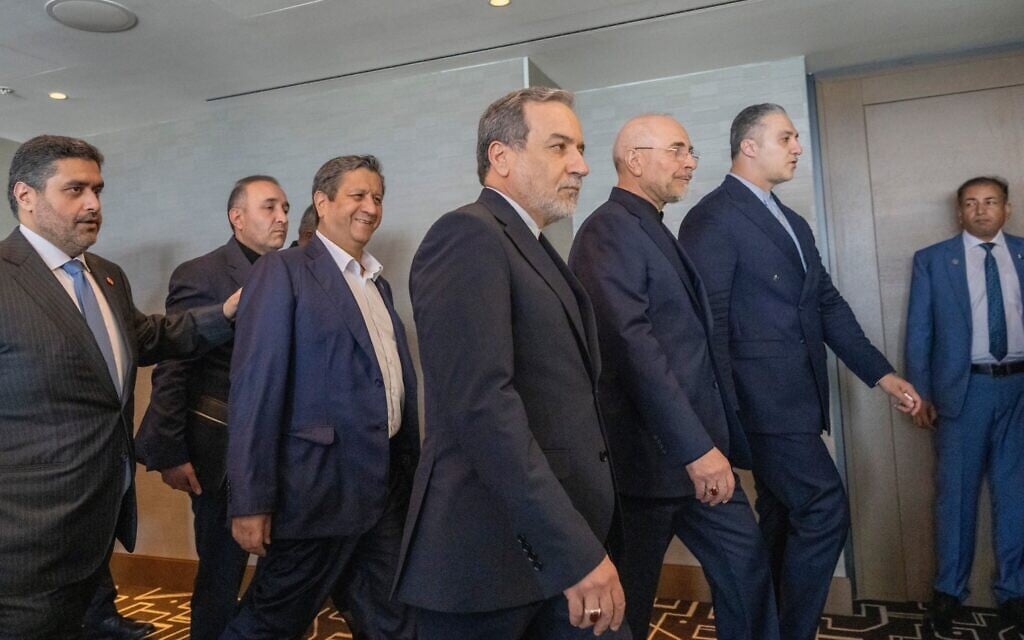Iranian Foreign Minister Abbas Araghchi, third from right, and Speaker of the Iranian Parliament Mohammed Bagher Ghalibaf, second from right, with the delegation of Iran at the Lake Lucerne Summit at the Buergenstock resort in Switzerland, June 21, 2026. (Urs Flueeler, Pool Photo via AP)