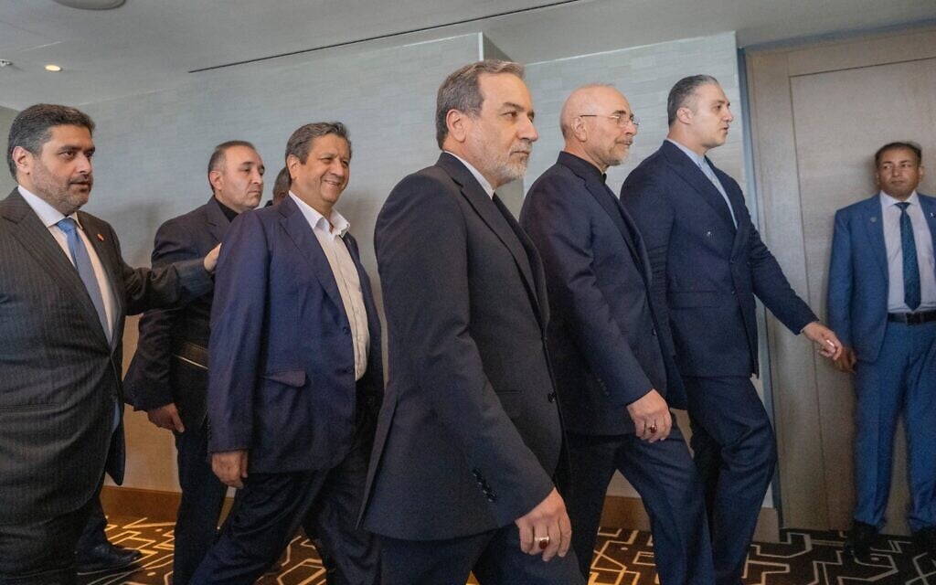 Iranian Foreign Minister Abbas Araghchi, third from right, and Speaker of the Iranian Parliament Mohammed Bagher Ghalibaf, second from right, with the delegation of Iran at the Lake Lucerne Summit at the Buergenstock resort in Switzerland, June 21, 2026. (Urs Flueeler, Pool Photo via AP)