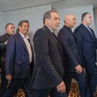 Iranian Foreign Minister Abbas Araghchi, third from right, and Speaker of the Iranian Parliament Mohammed Bagher Ghalibaf, second from right, with the delegation of Iran at the Lake Lucerne Summit at the Buergenstock resort in Switzerland, June 21, 2026. (Urs Flueeler, Pool Photo via AP)