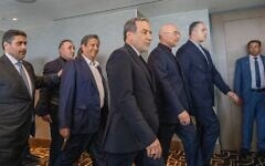 Iranian Foreign Minister Abbas Araghchi, third from right, and Speaker of the Iranian Parliament Mohammed Bagher Ghalibaf, second from right, with the delegation of Iran at the Lake Lucerne Summit at the Buergenstock resort in Switzerland, June 21, 2026. (Urs Flueeler, Pool Photo via AP)