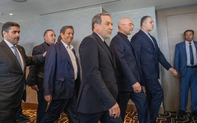 Iranian Foreign Minister Abbas Araghchi, third from right, and Speaker of the Iranian Parliament Mohammed Bagher Ghalibaf, second from right, with the delegation of Iran at the Lake Lucerne Summit at the Buergenstock resort in Switzerland, June 21, 2026. (Urs Flueeler, Pool Photo via AP)