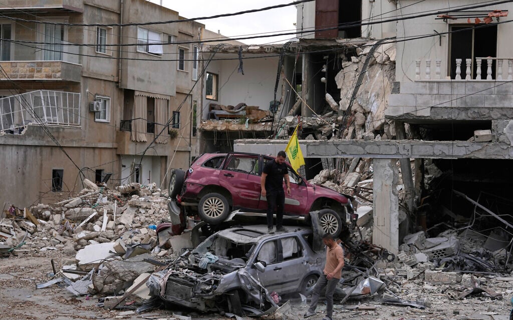 People check destroyed cars following a ceasefire between Israel and Hezbollah in the village of Maifadoun, southern Lebanon, June 22, 2026. (AP Photo/Mohammed Zaatari)