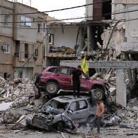 People check destroyed cars following a ceasefire between Israel and Hezbollah in the village of Maifadoun, southern Lebanon, June 22, 2026. (AP Photo/Mohammed Zaatari)