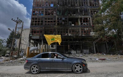 A man with a Hezbollah flag drives past a damaged building following a ceasefire between Israel and Hezbollah in the town of Nabatiyeh, southern Lebanon, June 22, 2026. (AP Photo/ Mohammed Zaatari) A man with a Hezbollah flag drives past a damaged building following a ceasefire between Israel and Hezbollah in the town of Nabatiyeh, southern Lebanon, June 22, 2026. (AP Photo/ Mohammed Zaatari)