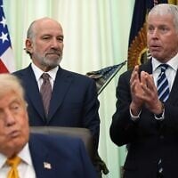 US Energy Secretary Chris Wright (R) speaks as US Commerce Secretary Howard Lutnick and US President Donald Trump listen in the Oval Office of the White House during an executive order signing about quantum computing, on June 22, 2026, in Washington. (AP/Jacquelyn Martin)