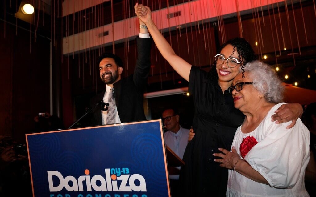 New York City Mayor Zohran Mamdani celebrates with Democratic congressional candidate Darializa Avila Chevalier and organizer Carmen Rojas during an election night watch party, June 23, 2026, in New York. (AP Photo/Seth Wenig)