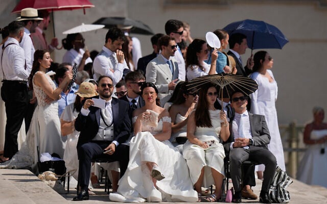 Faithful shelter from the hot sun as they wait for the weekly general audience with Pope Leo XIV in St. Peter's Square at The Vatican on June 24, 2026. (AP Photo/Alessandra Tarantino) Faithful shelter from the hot sun as they wait for the weekly general audience with Pope Leo XIV in St. Peter's Square at The Vatican on June 24, 2026. (AP Photo/Alessandra Tarantino)