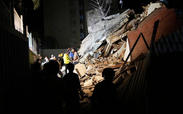 Rescue workers search through the rubble of a collapsed building for survivors after an earthquake in Caracas, Venezuela, June 24, 2026. (AP Photo/Ariana Cubillos) Rescue workers search through the rubble of a collapsed building for survivors after an earthquake in Caracas, Venezuela, June 24, 2026. (AP Photo/Ariana Cubillos)