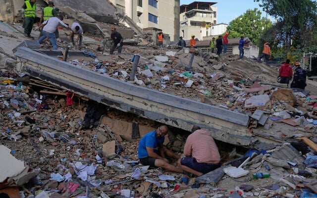 Residents and rescue workers search through the rubble of a building that collapsed in earthquakes that struck the previous day in Caracas, Venezuela, June 25, 2026. (AP/Ariana Cubillos) Residents and rescue workers search through the rubble of a building that collapsed in earthquakes that struck the previous day in Caracas, Venezuela, June 25, 2026. (AP/Ariana Cubillos)