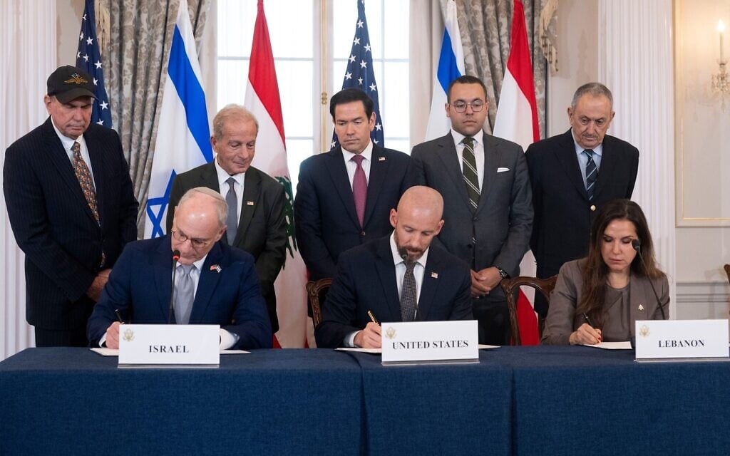 US Secretary of State Marco Rubio and others watch, seated from left, Israel's Ambassador to the US Yechiel Leiter, counselor Dan Holler, and Lebanon's Ambassador to the US Nada Hamadeh, sign a framework agreement at the State Department, Friday, June 26, 2026, in Washington. (AP Photo/Kevin Wolf)