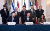 US Secretary of State Marco Rubio and others watch, seated from left, Israel's Ambassador to the US Yechiel Leiter, counselor Dan Holler, and Lebanon's Ambassador to the US Nada Hamadeh, sign a framework agreement at the State Department, June 26, 2026, in Washington. (AP/Kevin Wolf)