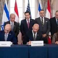 US Secretary of State Marco Rubio and others watch, seated from left, Israel's Ambassador to the US Yechiel Leiter, counselor Dan Holler, and Lebanon's Ambassador to the US Nada Hamadeh, sign a framework agreement at the State Department, Friday, June 26, 2026, in Washington. (AP Photo/Kevin Wolf)