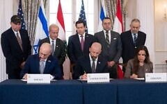 US Secretary of State Marco Rubio and others watch, seated from left, Israel's Ambassador to the US Yechiel Leiter, counselor Dan Holler, and Lebanon's Ambassador to the US Nada Hamadeh, sign a framework agreement at the State Department, Friday, June 26, 2026, in Washington. (AP Photo/Kevin Wolf)