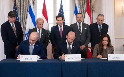 US Secretary of State Marco Rubio and others watch, seated from left, Israel's Ambassador to the US Yechiel Leiter, counselor Dan Holler, and Lebanon's Ambassador to the US Nada Hamadeh, sign a framework agreement at the State Department, Friday, June 26, 2026, in Washington. (AP Photo/Kevin Wolf)