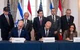US Secretary of State Marco Rubio and others watch, as seated from left, Israel's Ambassador to the US Yechiel Leiter, counselor Dan Holler, and Lebanon's Ambassador to the US Nada Hamadeh, sign a framework agreement, described as a first step toward peace following months of conflict between Israel and Iran-backed Hezbollah, at the State Department, June 26, 2026, in Washington. (AP Photo/Kevin Wolf)