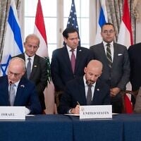 US Secretary of State Marco Rubio and others watch, as seated from left, Israel's Ambassador to the US Yechiel Leiter, counselor Dan Holler, and Lebanon's Ambassador to the US Nada Hamadeh, sign a framework agreement, described as a first step toward peace following months of conflict between Israel and Iran-backed Hezbollah, at the State Department, June 26, 2026, in Washington. (AP Photo/Kevin Wolf)