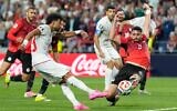 Egypt's Yasser Ibrahim (2) stops a shot from Iran's Ramin Rezaeian (23) during the World Cup Group G soccer match between Egypt and Iran in Seattle, Washington, June 26, 2026. (AP Photo/Lindsey Wasson)