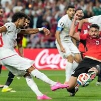Egypt's Yasser Ibrahim (2) stops a shot from Iran's Ramin Rezaeian (23) during the World Cup Group G soccer match between Egypt and Iran in Seattle, Washington, June 26, 2026. (AP Photo/Lindsey Wasson)