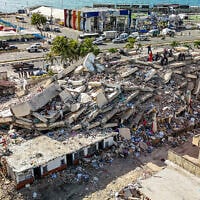 This aerial picture shows buildings destroyed during twin earthquakes in Caraballeda, La Guaira state, Venezuela, on June 27, 2026. (Miguel Medina/Pool Photo via AP)