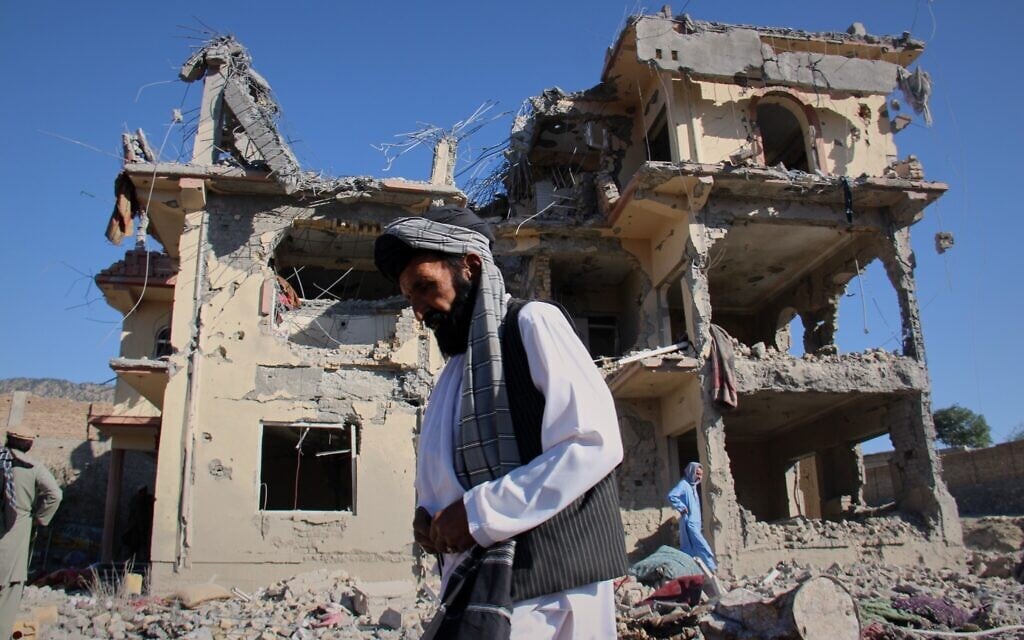 Residents walk through the rubble after what Taliban officials said were Pakistani airstrikes a day earlier that killed civilians, including children, in the village of Mandokhail, Chamkani district, Paktia province, Afghanistan, June 29, 2026. (AP/Saifullah Zahir)