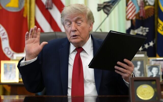 US President Donald Trump holds a signed presidential memo in the Oval Office of the White House, June 29, 2026, in Washington. (AP/Jacquelyn Martin) US President Donald Trump holds a signed presidential memo in the Oval Office of the White House, June 29, 2026, in Washington. (AP/Jacquelyn Martin)