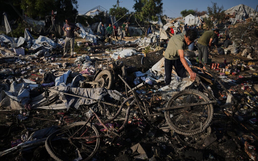 Palestinians inspect damage to their tents following an Israeli airstrike in Khan Younis, Gaza Strip, Tuesday, June 30, 2026. (AP Photo/Abdel Kareem Hana)