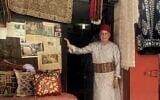 Bilal Abu Khalaf stands in front of his store in Muristan Square in the Old City of Jerusalem, May 2026. (Sarah Tuttle-Singer)